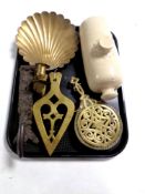 A tray of stoneware hot water bottle, antique metal wares to include brass trivets,