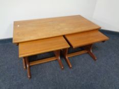A nest of three 20th century teak G-Plan tables.