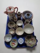 A tray containing a quantity of antique oriental wares to include teapot, tea bowls,