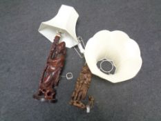 Two Chinese carved root wood figural table lamps with shades