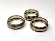 A set of three silver napkin rings.