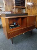 A 20th century HMV music centre in teak cabinet (a/f)