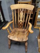 A pine farmhouse kitchen armchair