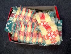 A box of fringed multi colour rug,
