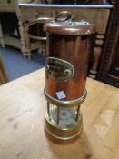 A Lamp and Limelight brass and copper miner's lamp