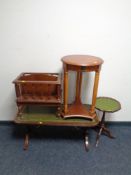 A leather topped coffee table with under stretcher together with a Canterbury,