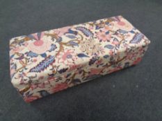A 19th century pine storage Ottoman upholstered in a floral fabric