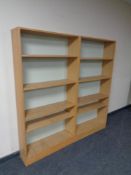 Two sets of oak effect open bookshelves