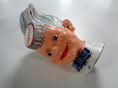 A cast iron novelty money box - Coca Cola boy