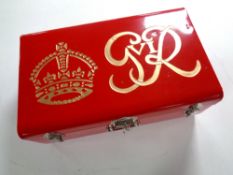 A metal storage case initialed G R