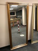 A rectangular bronze effect mirror,