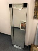 An all glass rectangular mirror,