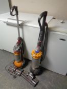 A Dyson DC40 ball vacuum together with Dyson DC24 ball vacuum
