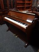 A mahogany cased Consolette overstrung mini piano