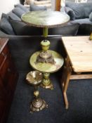 A pair of gilt and onyx effect wine tables together with a matching smoker's stand