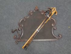 A metal spark guard together with a bundle of wooden walking sticks