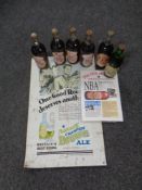 A tin Newcastle Brown Ale advertisement sign together with five commemorative bottles of Brown Ale,