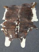 A cow hide rug