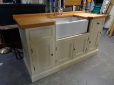 A painted pine farmhouse kitchen sink unit with Armitage Shanks Belfast sink fitted cupboards