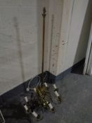 A brass Corinthian column standard lamp together with a further brass eight way light fitting