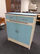 A mid 20th century kitchen cupboard