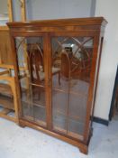 A mahogany Regency style glazed door double door bookcase