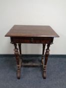 A stained beech occasional table fitted a drawer with understretcher