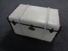 An early 20th century painted wooden bound trunk