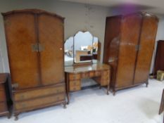 A four piece walnut Queen Anne bedroom suite comprising of lady's and gent's wardrobe,