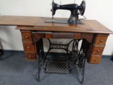 A 20th century Singer treadle sewing machine in table