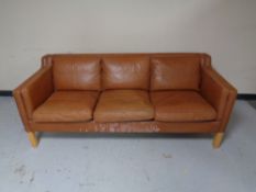 A 20th century Scandinavian brown leather three seater settee