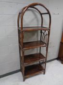 A set of bamboo dome topped open bookshelves