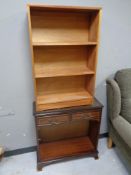 A set of 20th century teak open bookshelves together with a set of inlaid mahogany bookshelves
