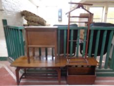 A 20th century oak sewing box together with an oak magazine rack,