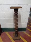 A beechwood barley twist plant stand