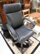 An executive swivel office armchair (as found)