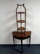 An Edwardian beech wood folding cake stand together with a demi lune table