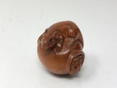 A carved Chinese hardwood netsuke - Two rats on a barrel