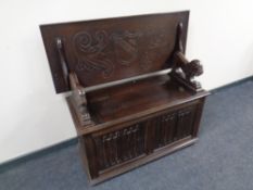 An oak storage monk's bench