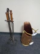 An antique copper and brass porcelain handled coal receiver together with a three piece wrought