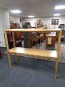 A pair of late 20th century hall tables in an oak finish