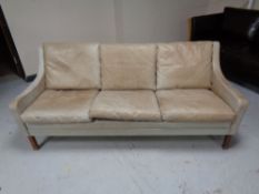 A 20th century Scandinavian leather three seater settee (faded)