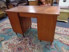 A mid 20th century Scandinavian teak twin pedestal desk