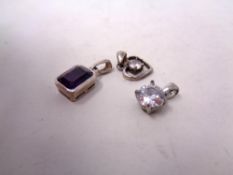 Three silver pendants