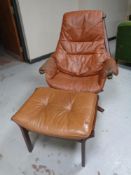A 20th century Scandinavian beech framed tan leather swivel armchair with stool