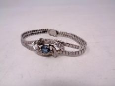 A white metal stone set bracelet