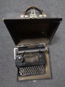 A boxed Eumig projector together with a further projector in a fitted wooden box