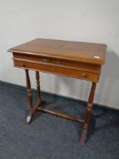 An Italian style occasional table fitted a drawer with understretcher