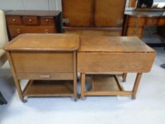 An oak drop leaf two tier tea trolley fitted a drawer,