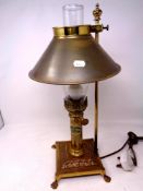 A reproduction brass Orient Express table lamp in the form of an oil lamp
